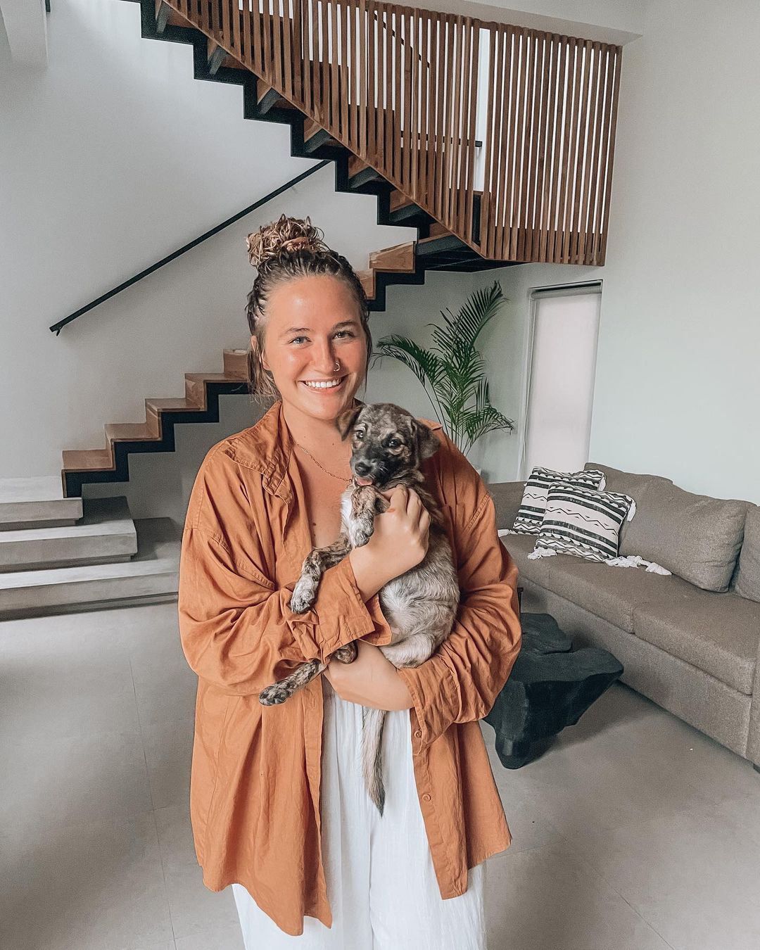 woman holding rescued dog