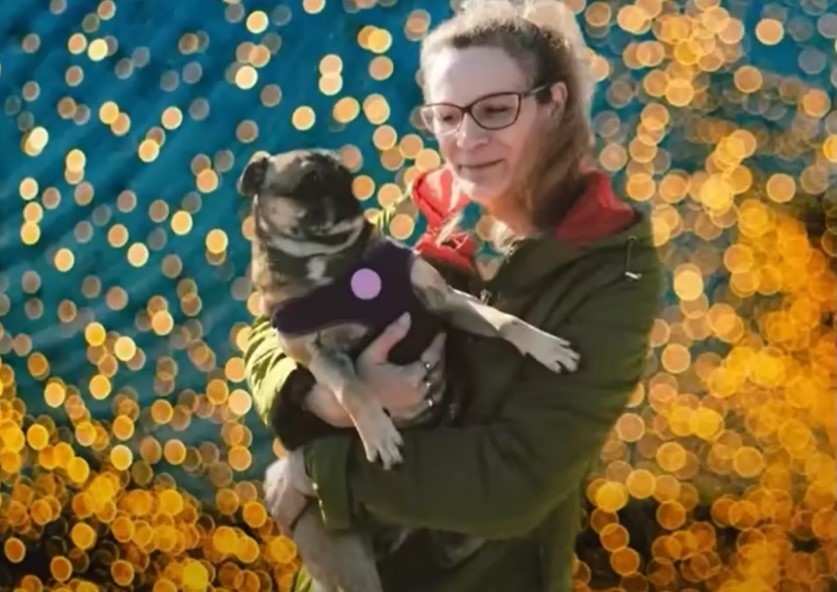 woman holding the dog