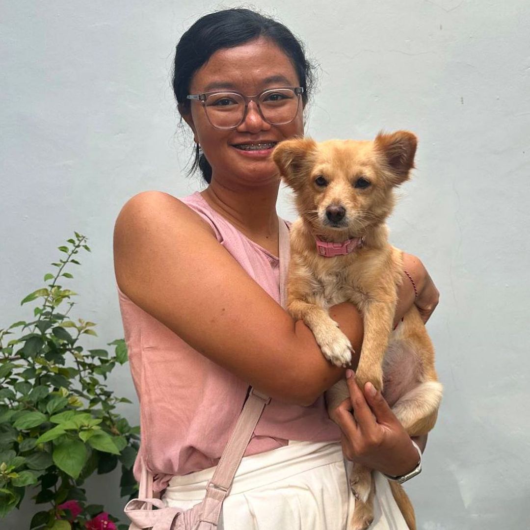 woman holding the dog