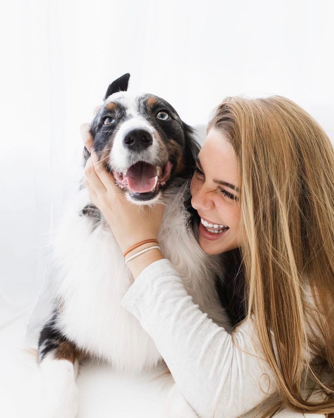 woman hugging the dog