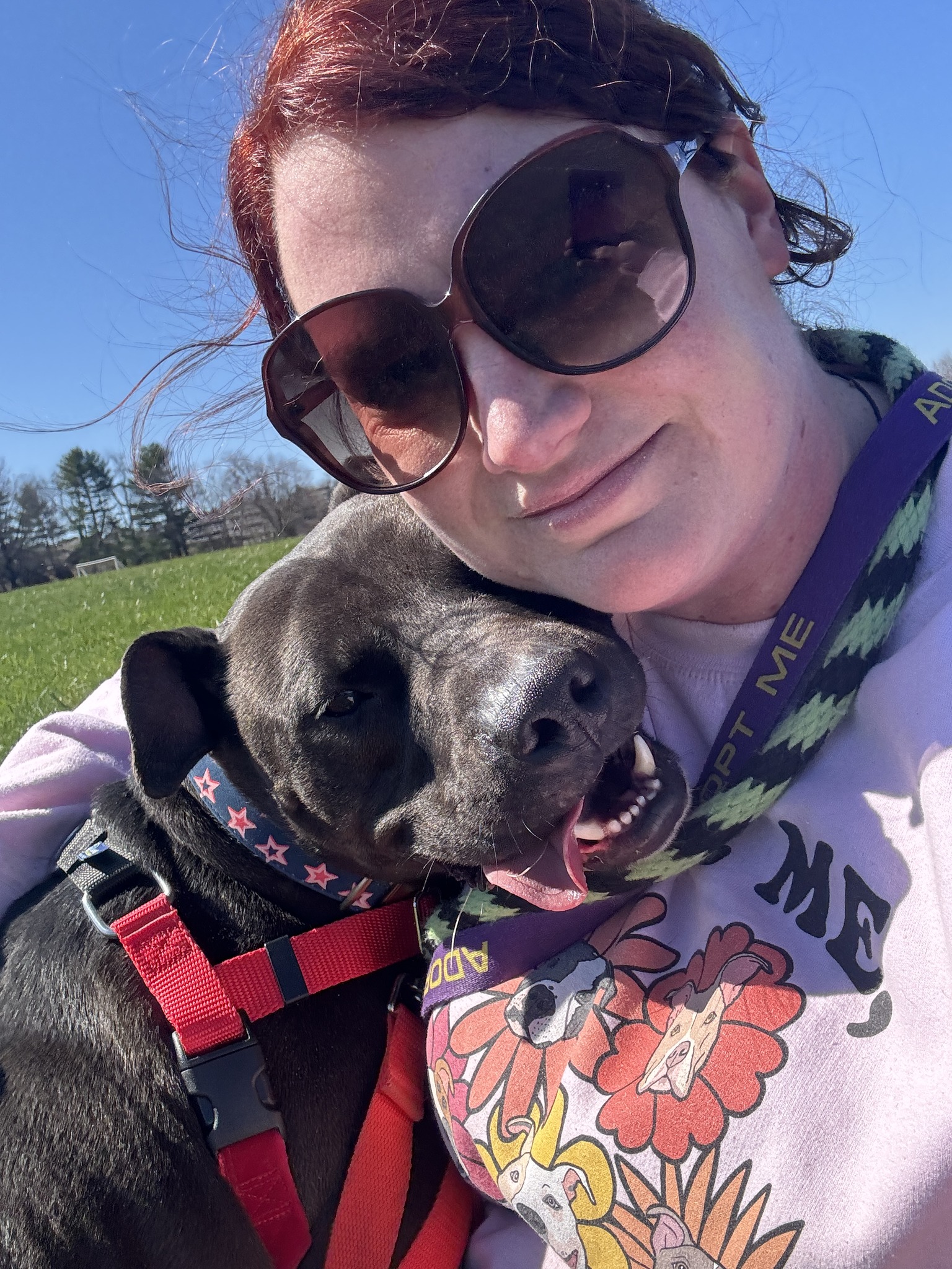 woman in hug with dog