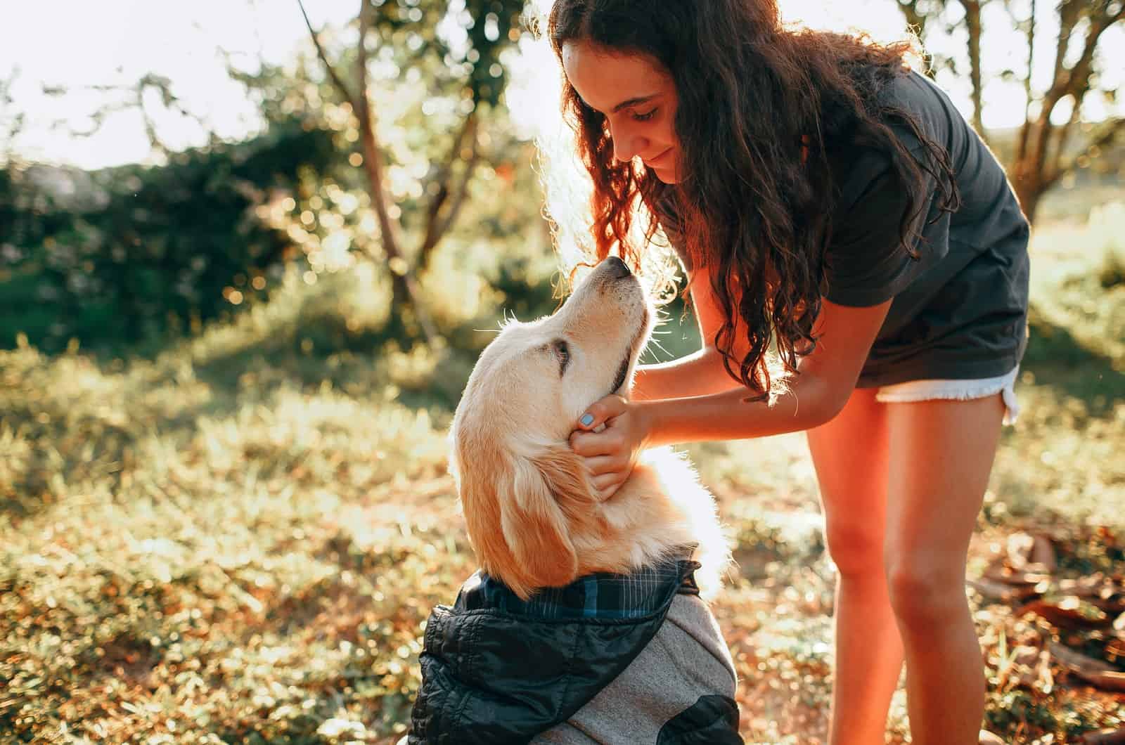 woman petting her dog