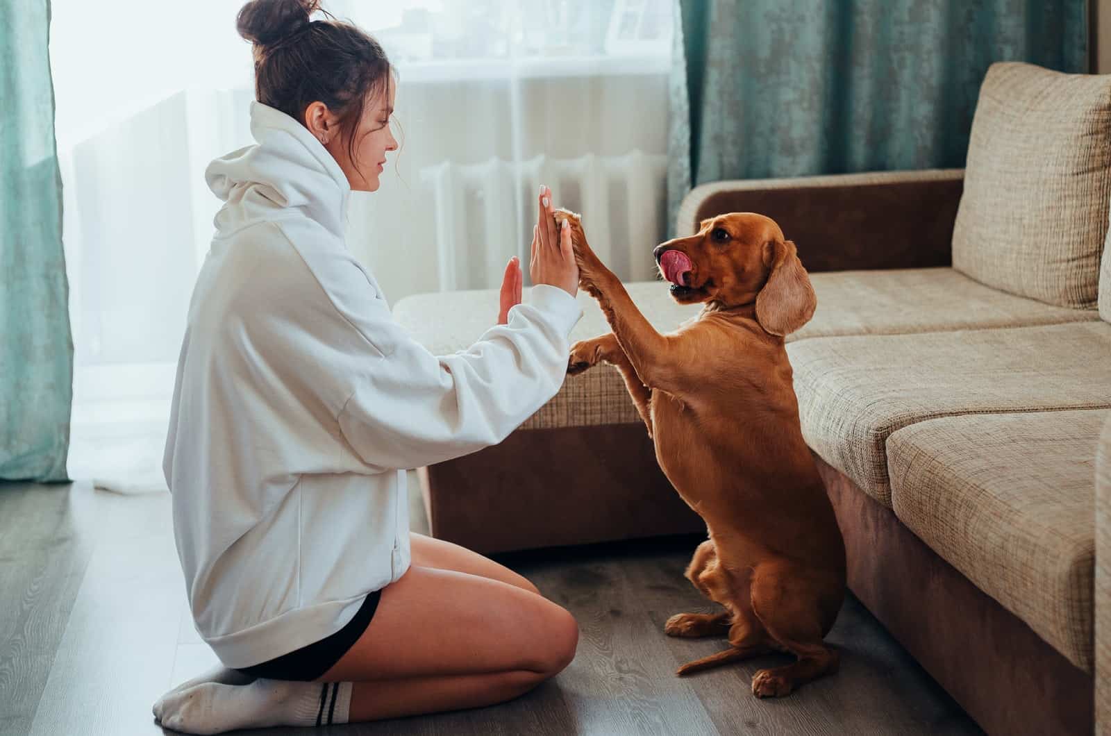 woman playing with her dog