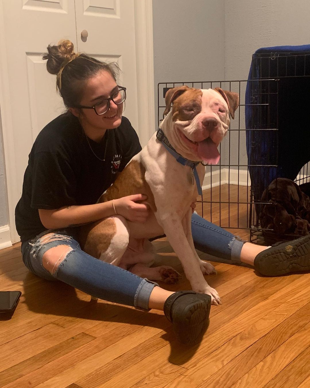 woman sitting with the pitbull