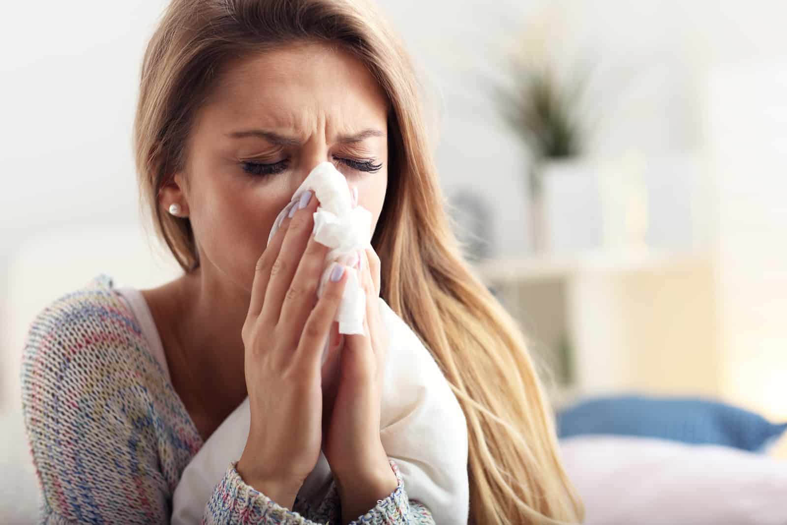 woman sneezing