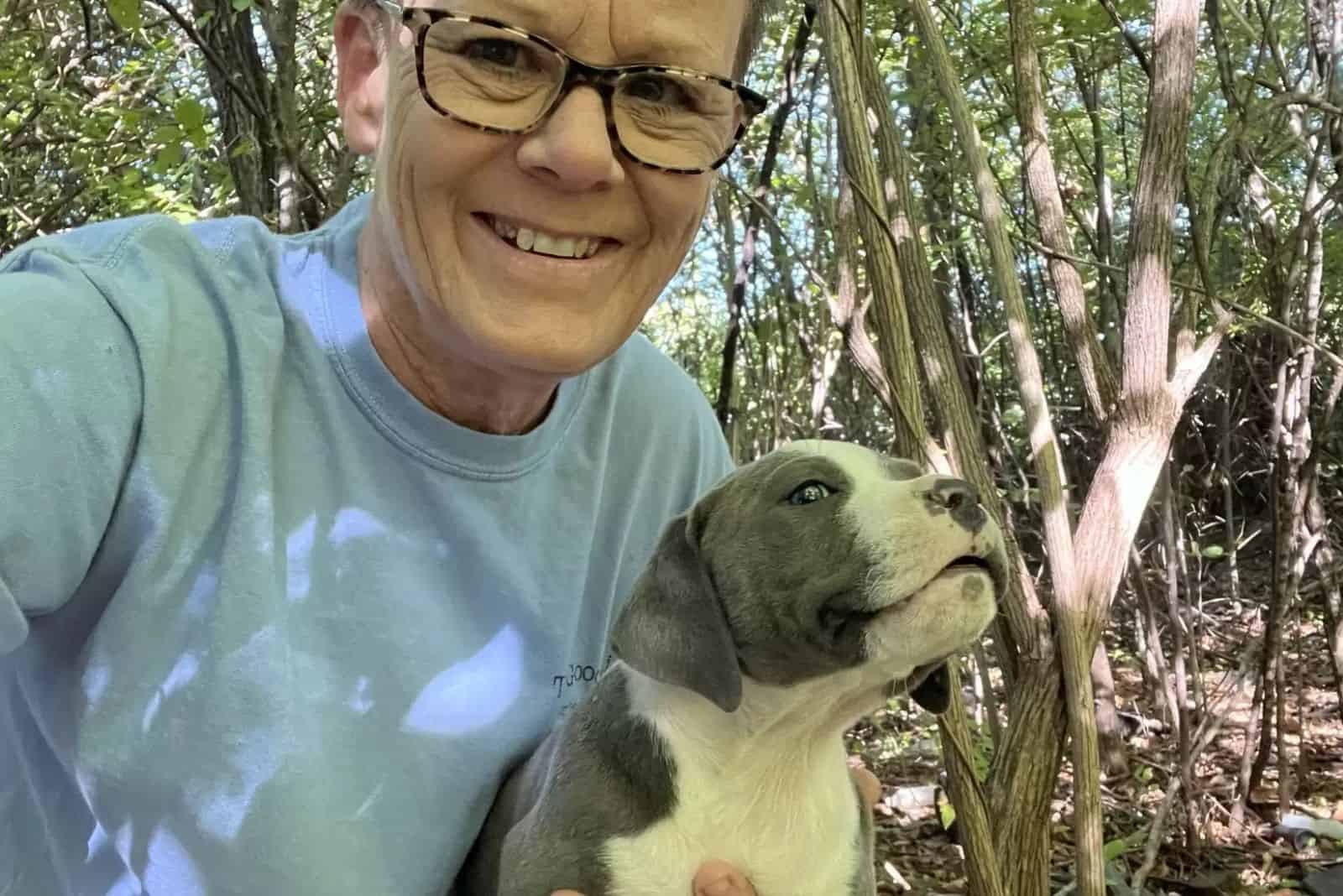 woman taking selfie with dog