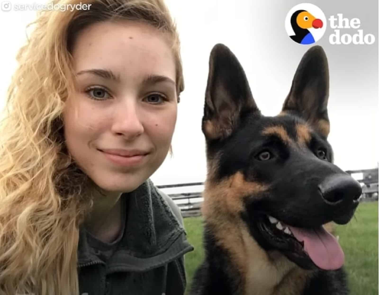 woman with german shepherd dog in the park