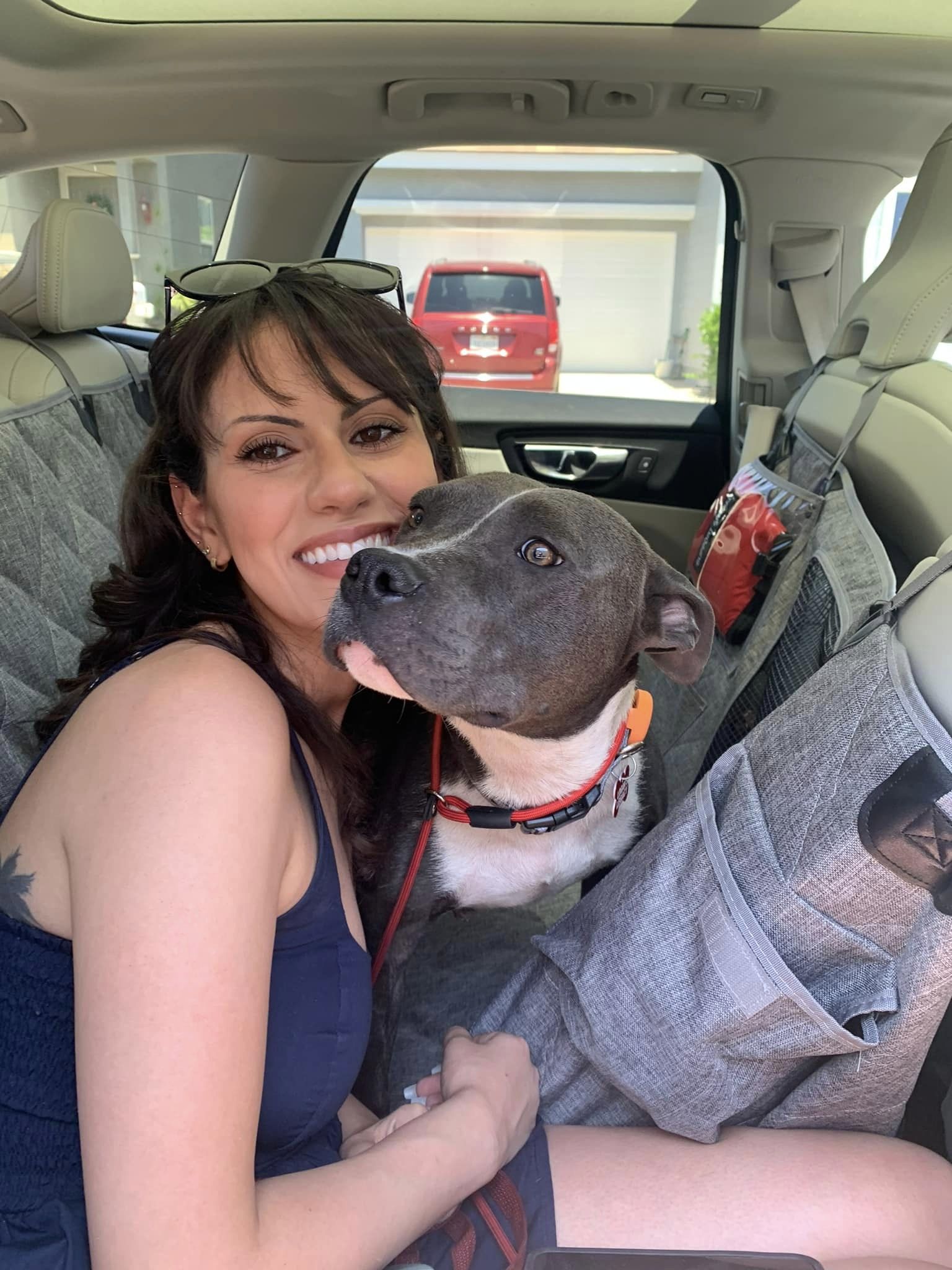 women in car with dog