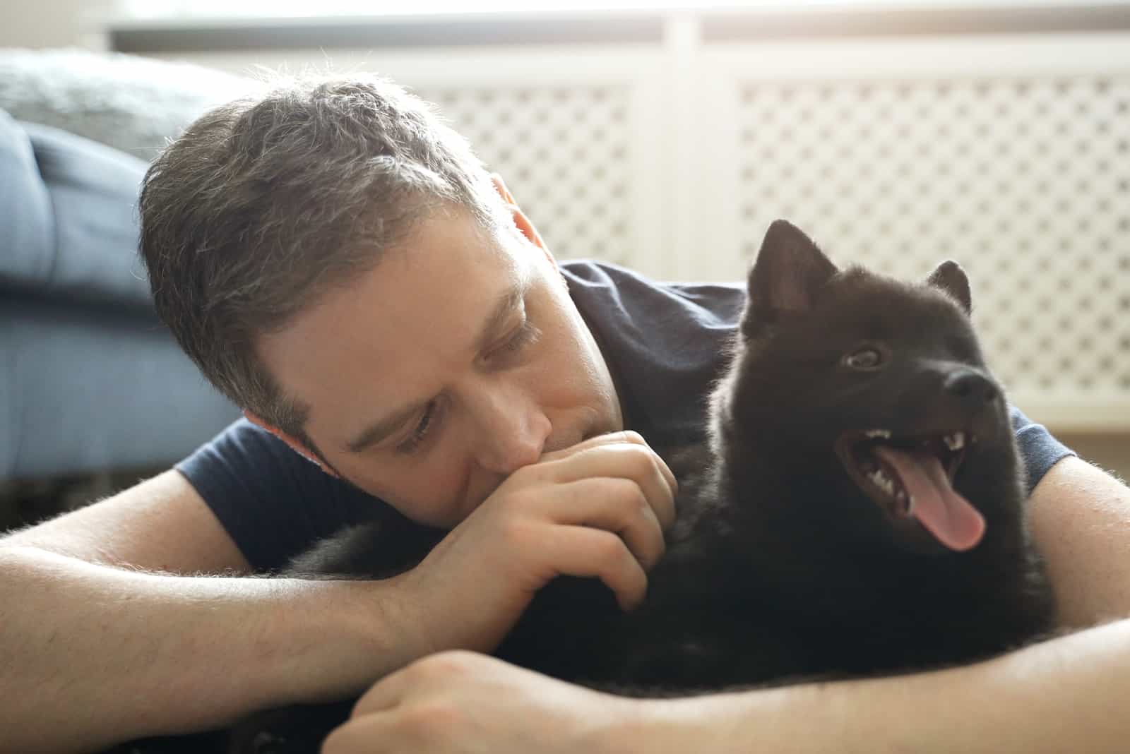 worried man petting his dog