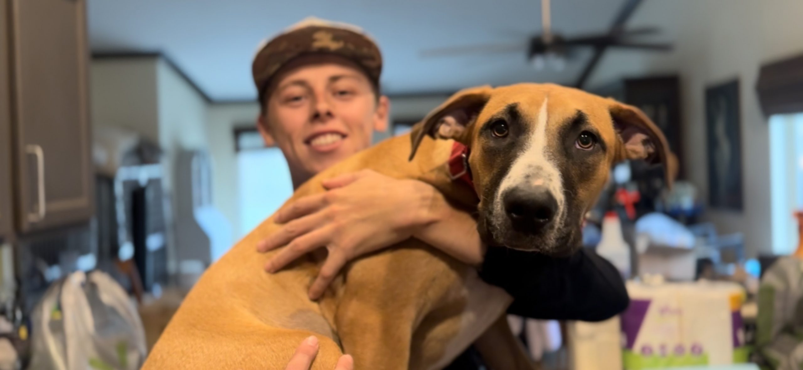 young man and adult dog