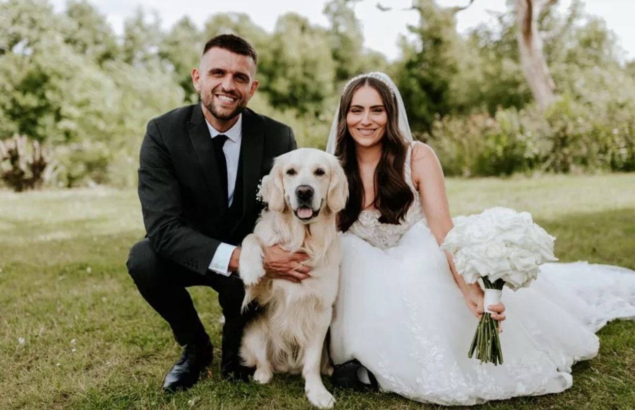 bride and groom with a dog