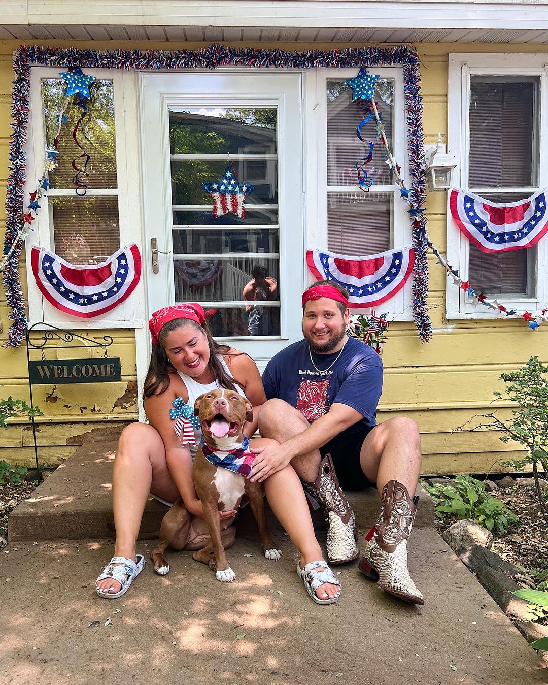 couple sitting with a dog