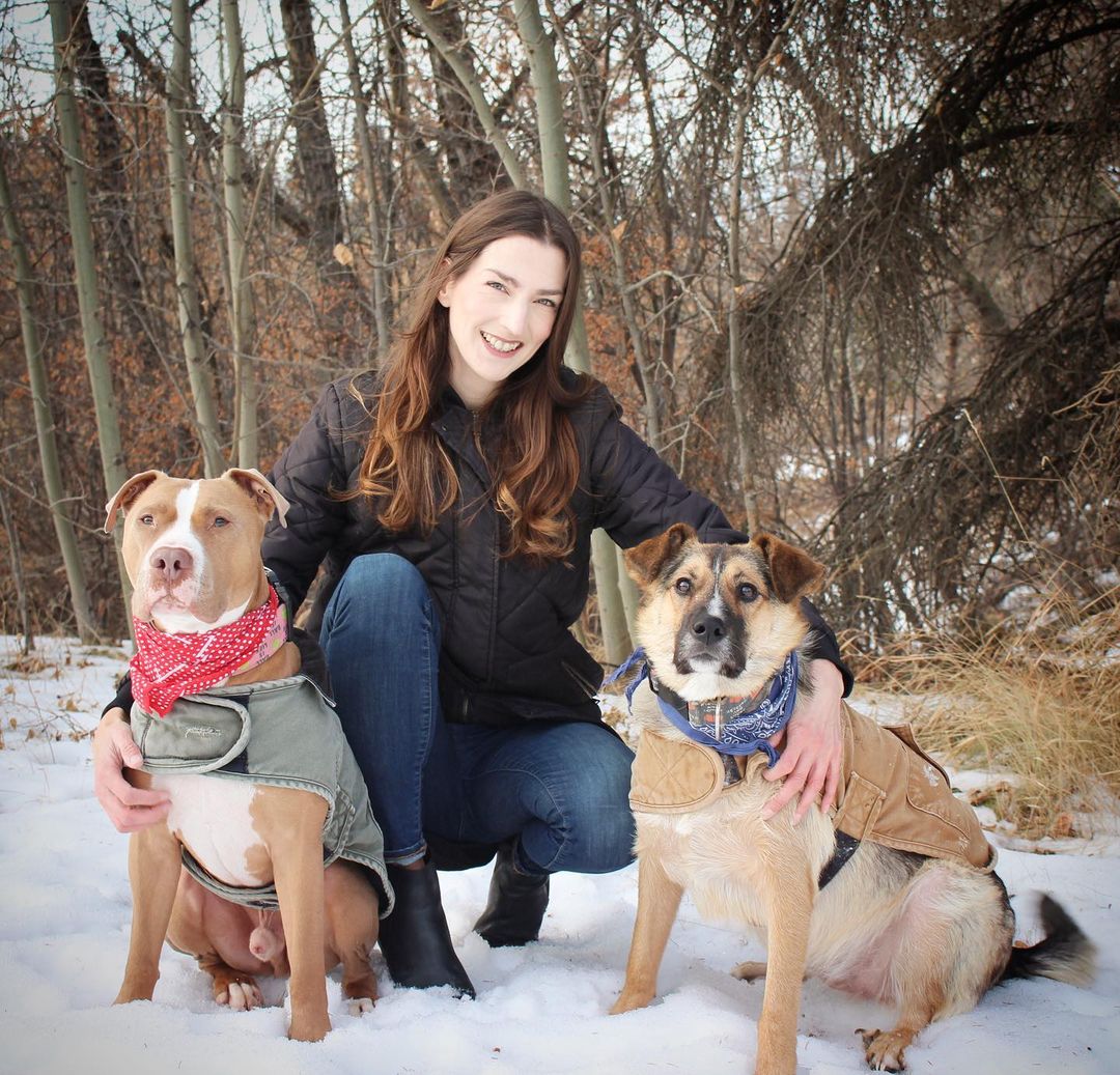 girl with two dogs