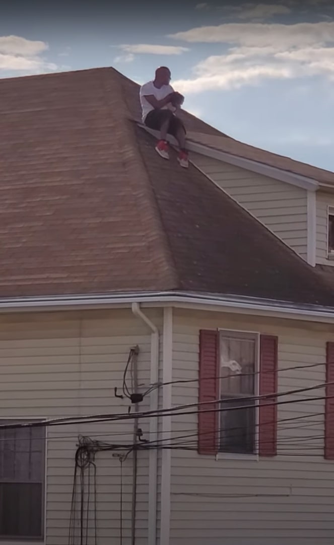 man rescuing dog