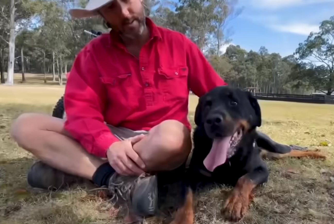 man sitting with dog