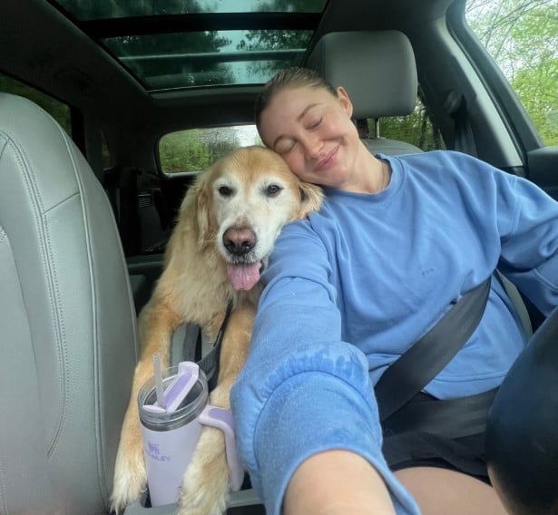 woman and dog in the car