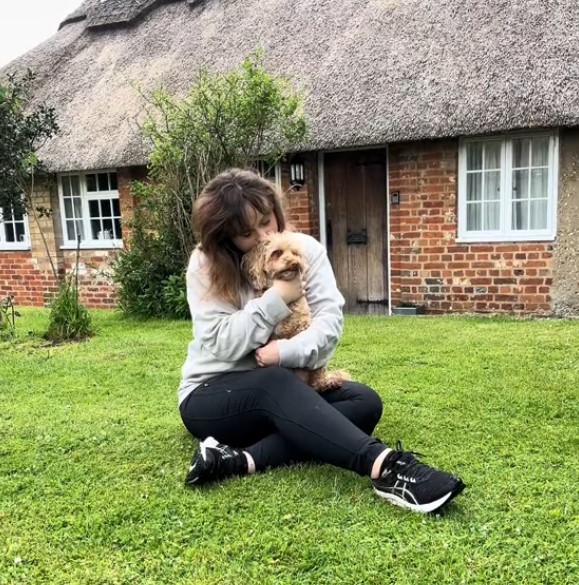 woman holding the dog