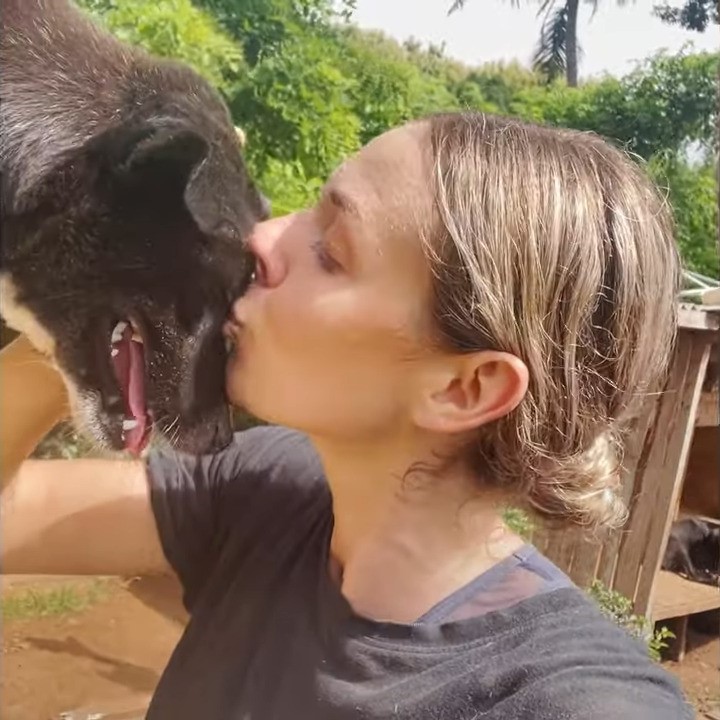 woman kissing the dog