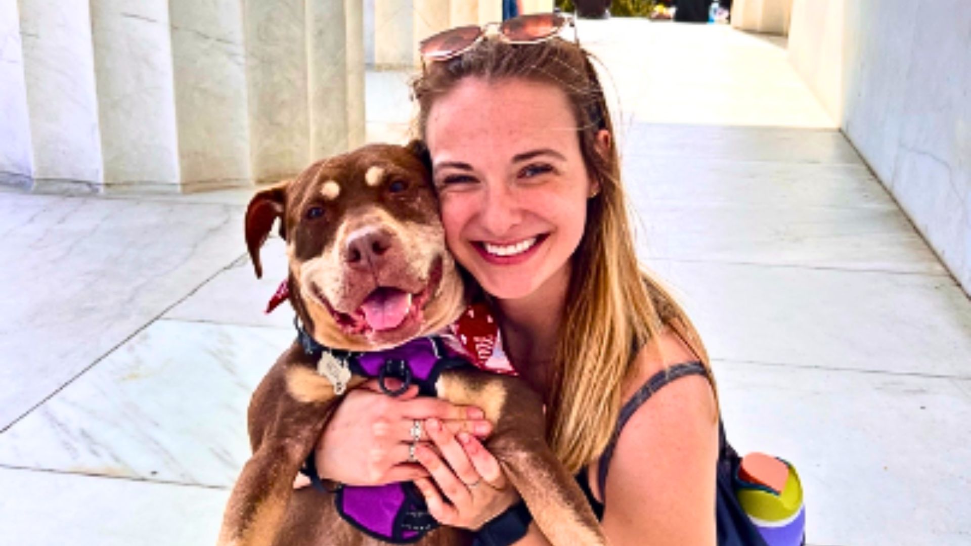 young woman posing with her dog