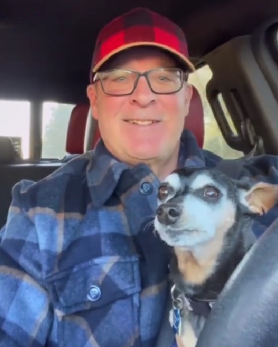 man holding dog with dementia