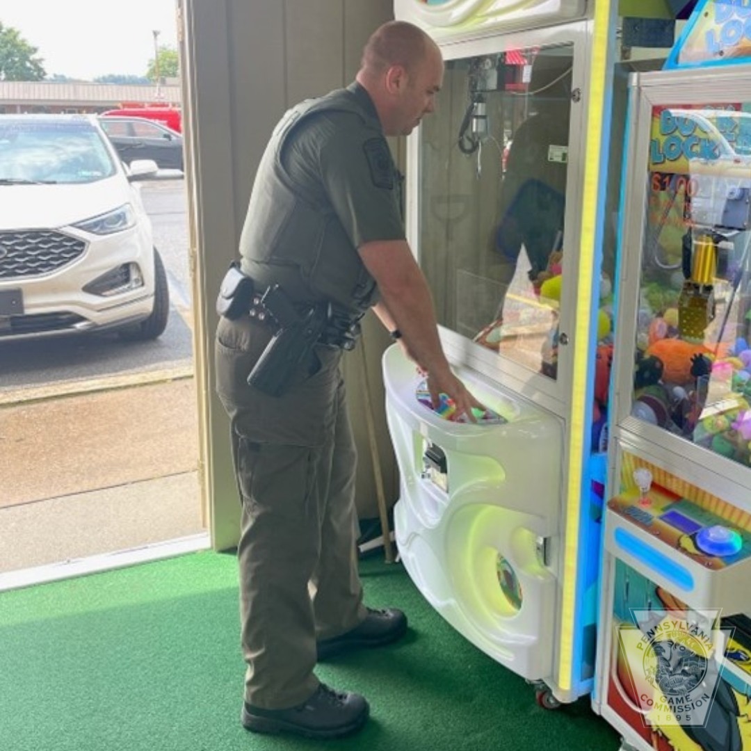 police officer by the toy machine