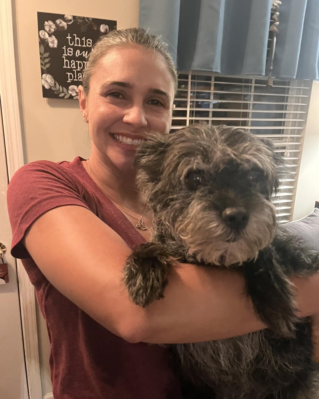 woman and very cute black dog