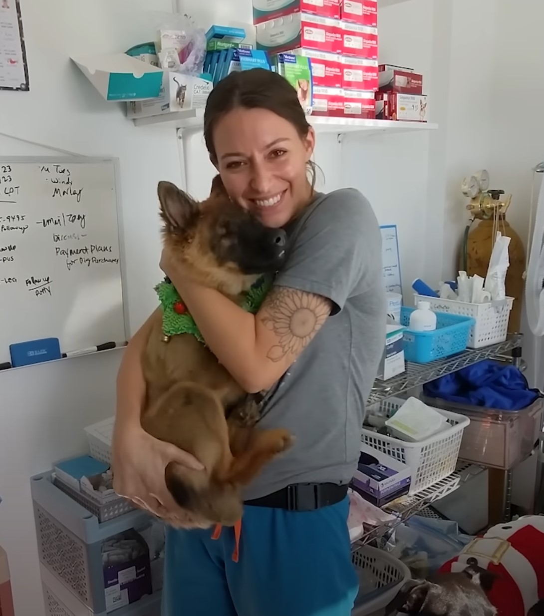 woman holding a blind dog