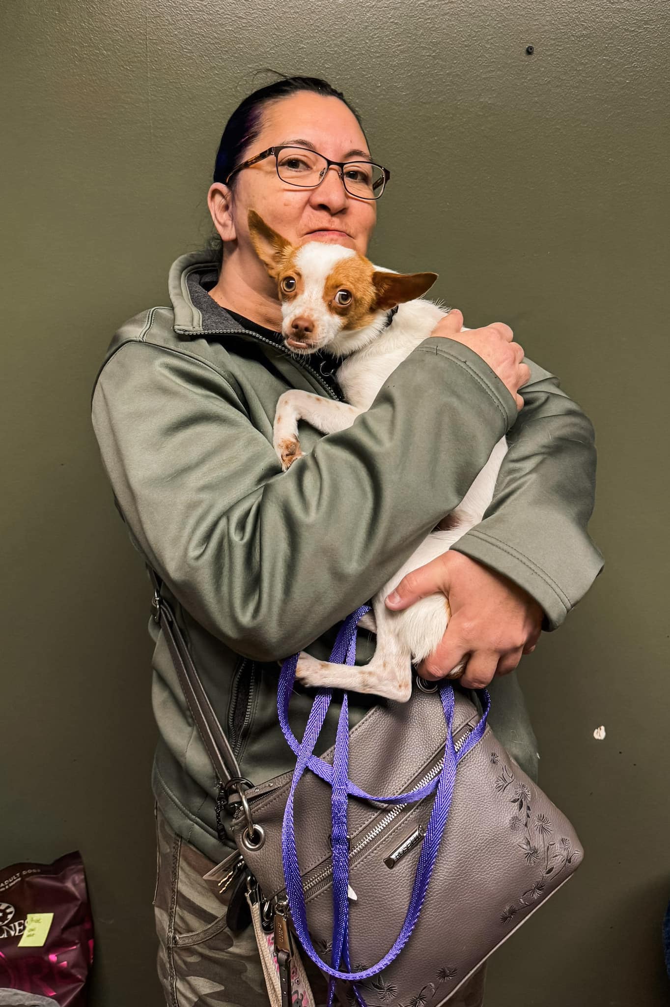 woman holding a dog