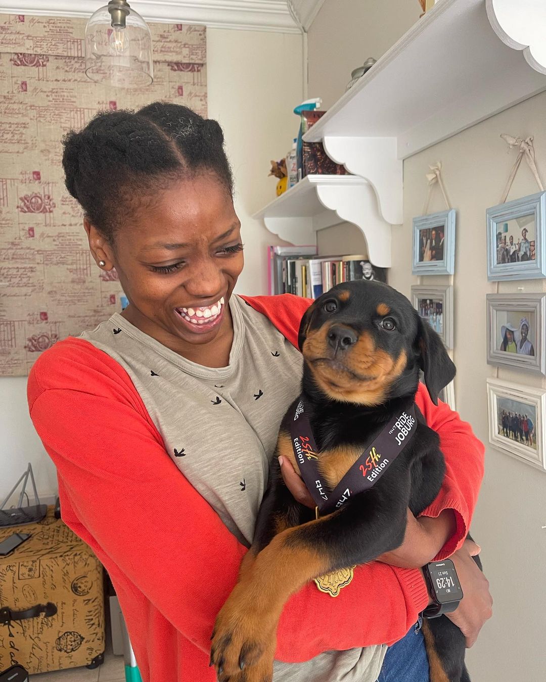 Woman holding Rottweiler