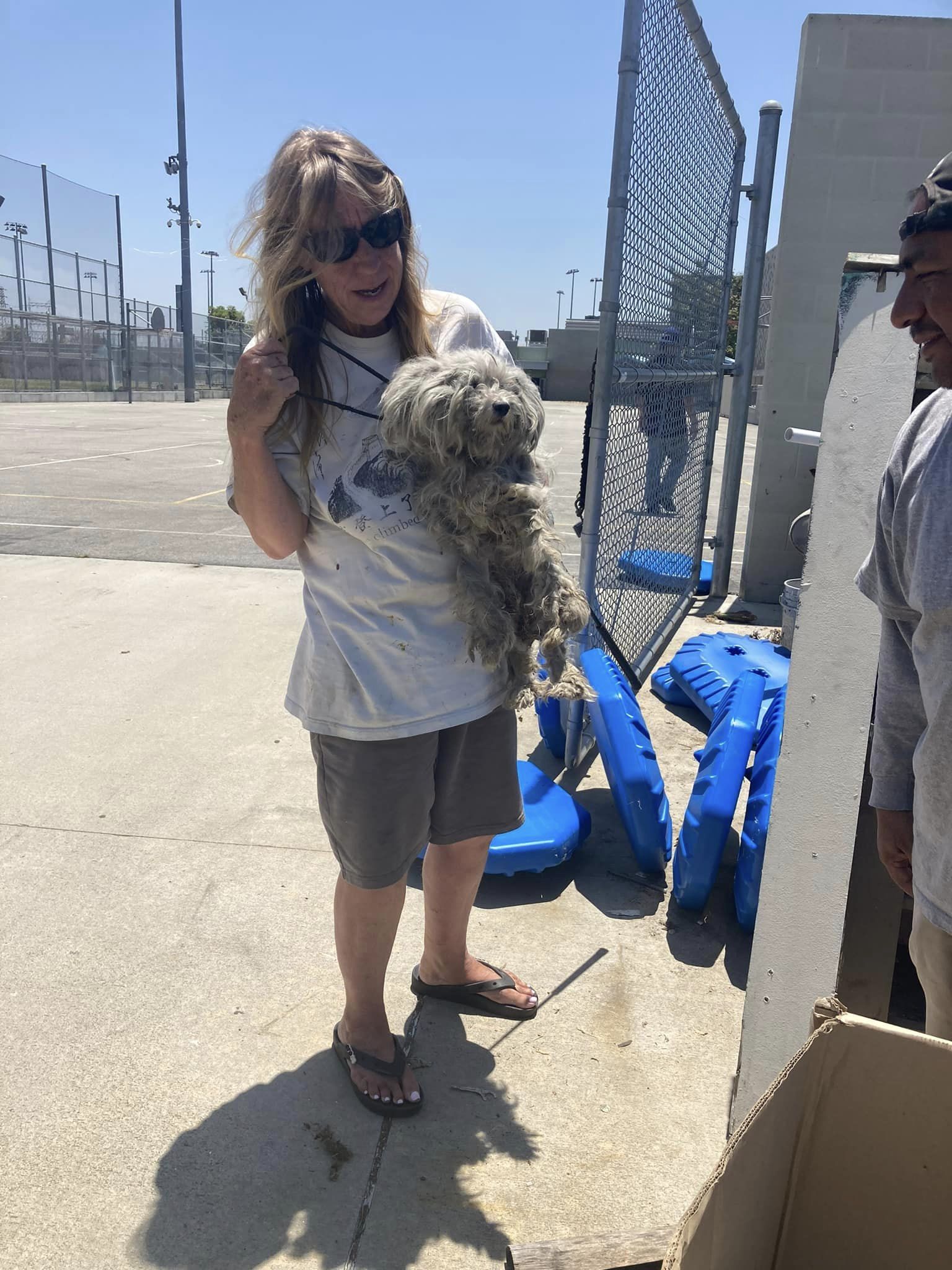 woman holding the dog