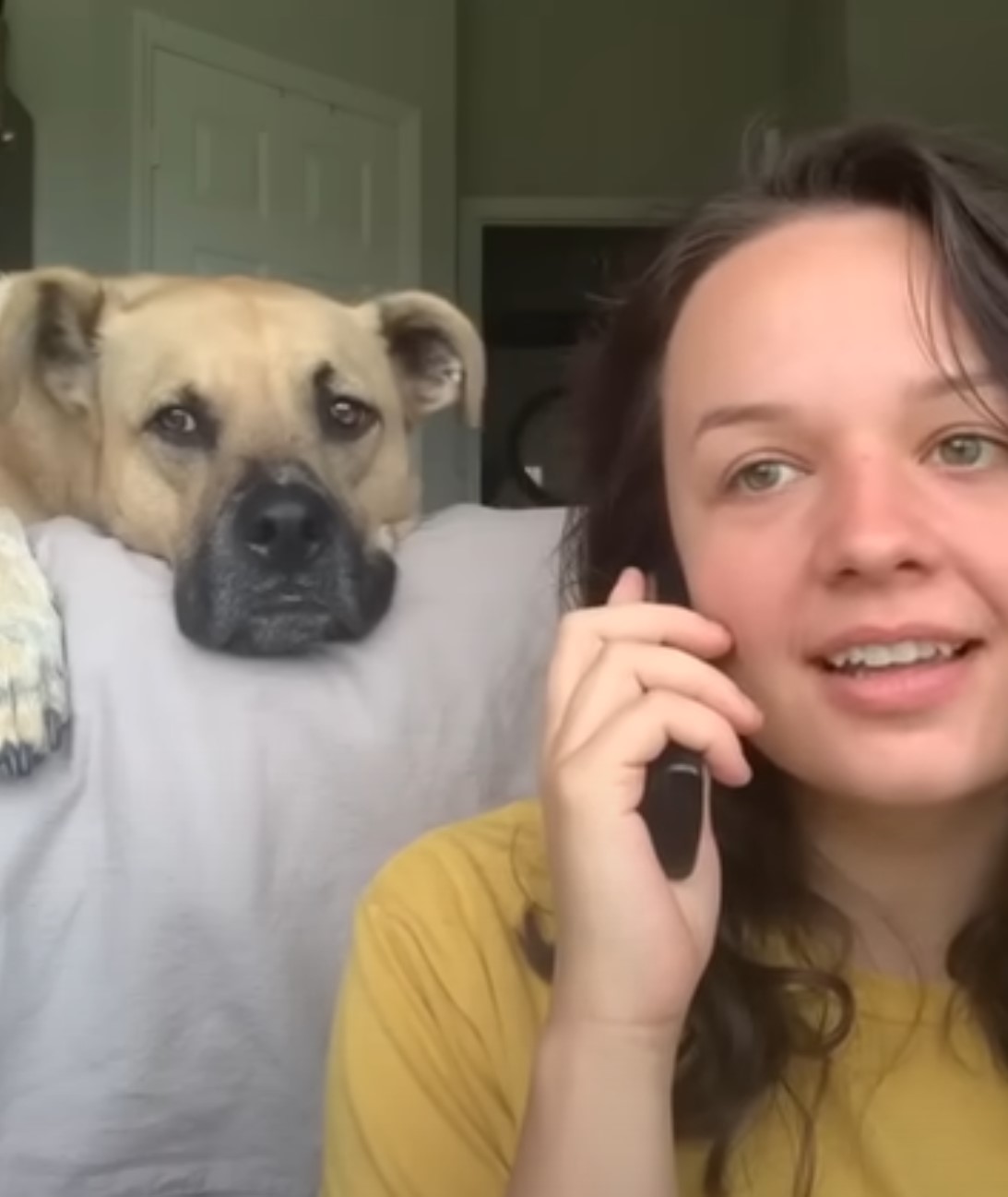 woman on couch listening woman talk on phone