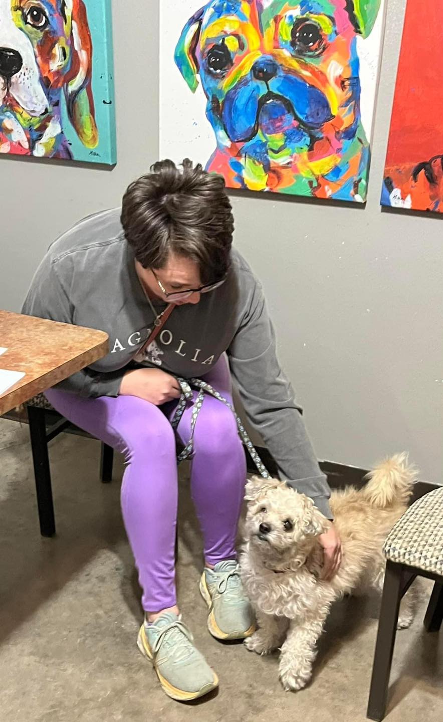 woman petting a dog