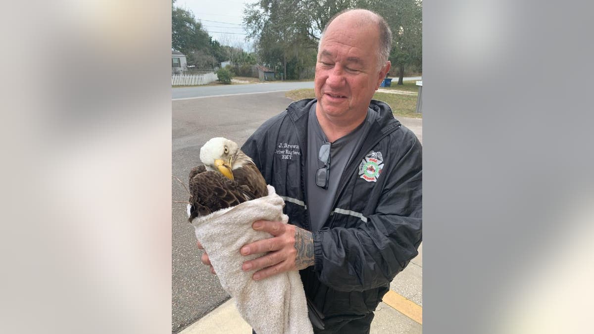 Driver Engineer Jerry Brown of Pasco County Fire Rescue assisted the two children who found the injured bald eagle.