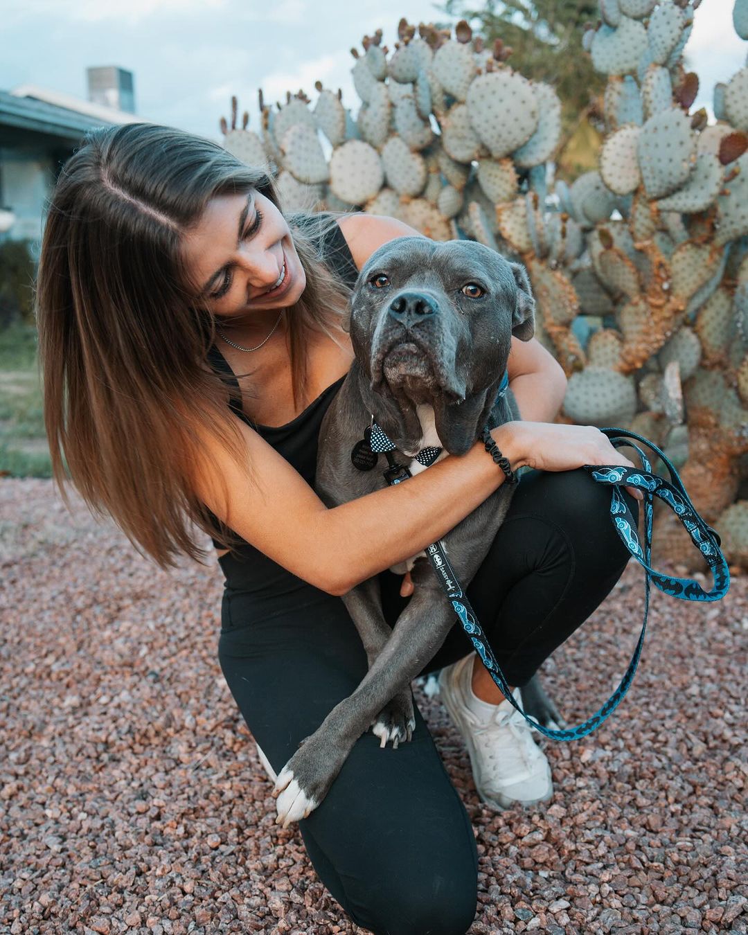 smiling woman with an old looking dog