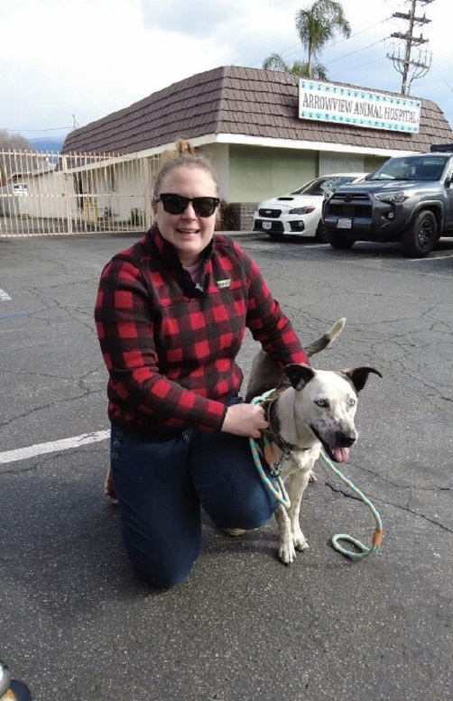 woman and dog posing for picture