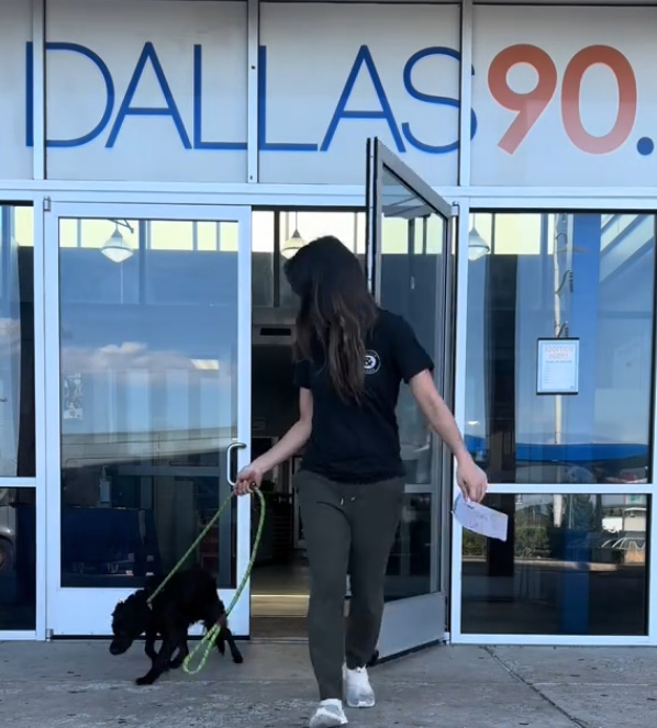 woman and dog walking out of shelter