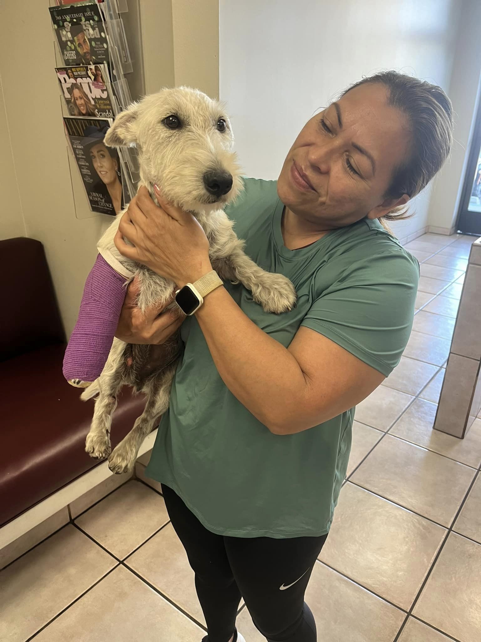 woman and dog with broken leg