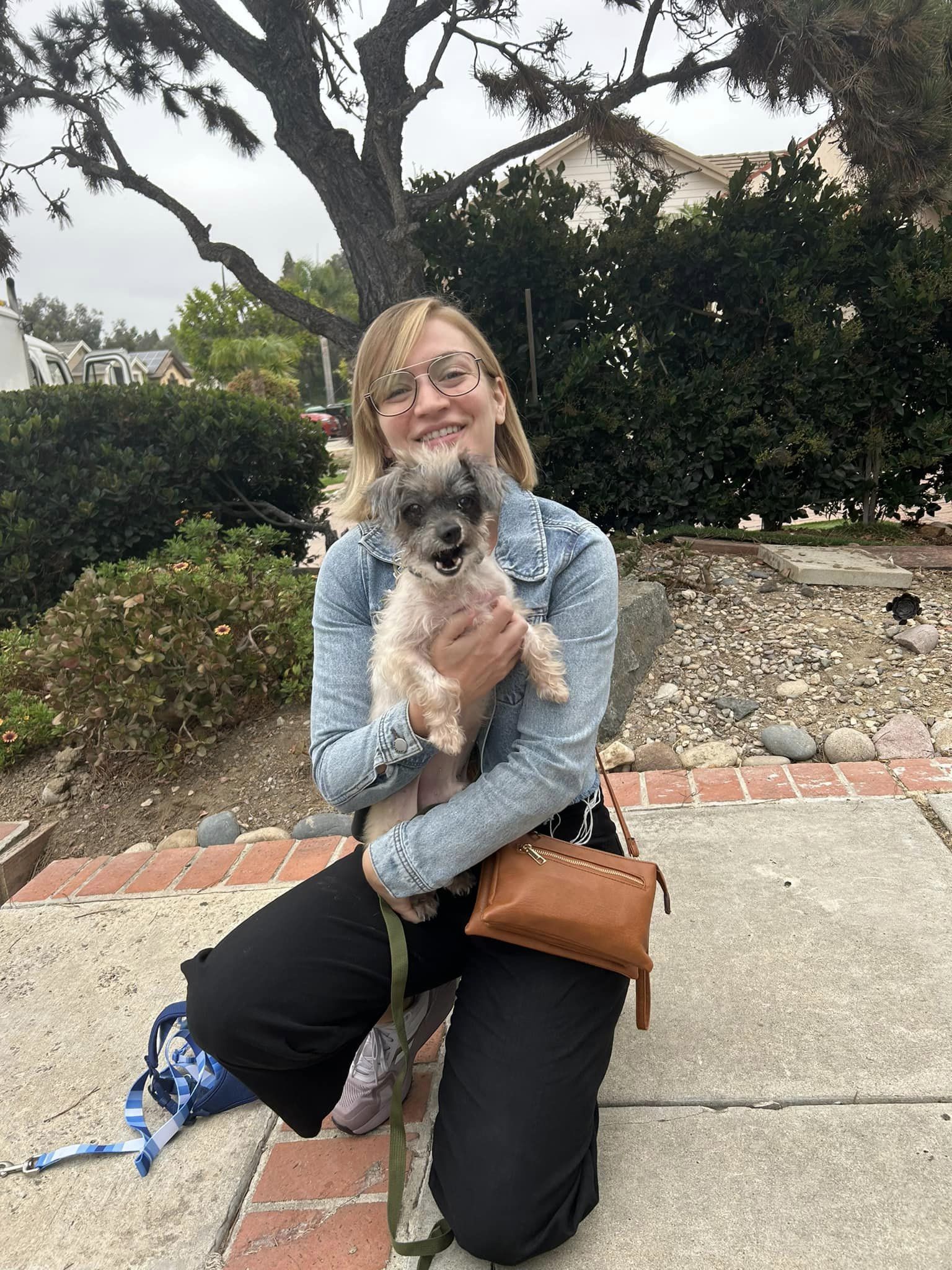 woman carrying a pup